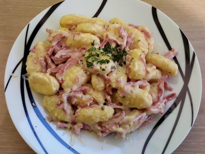 Gnocchi, bacon and soft creamy cheese